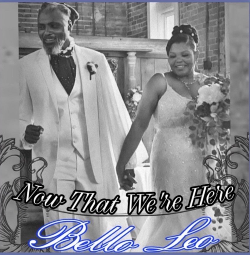 Cover art for Now That We&rsquo;re Here by Bello Leo: a black-and-white photo of a bride and groom walking hand in hand